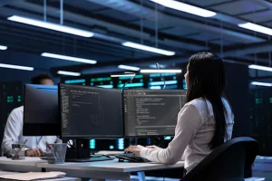 Specialist at a computer studying the scope of igaming platform development
